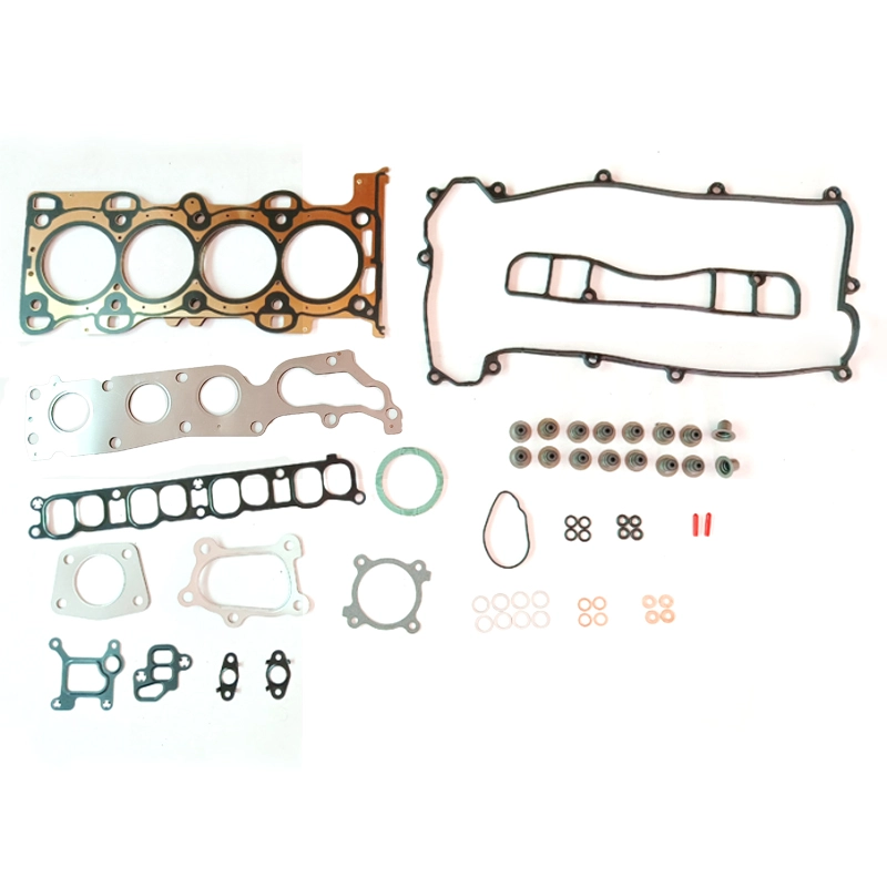 Engine rebuild gasket set laid out on a white surface.