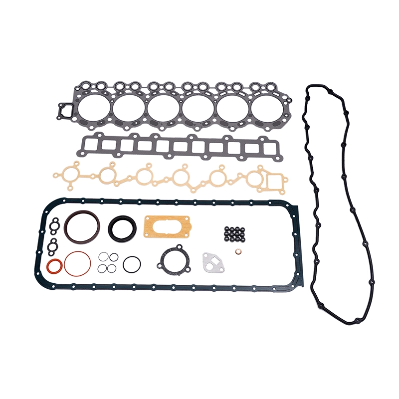 Engine rebuild gasket set laid out on a white background.