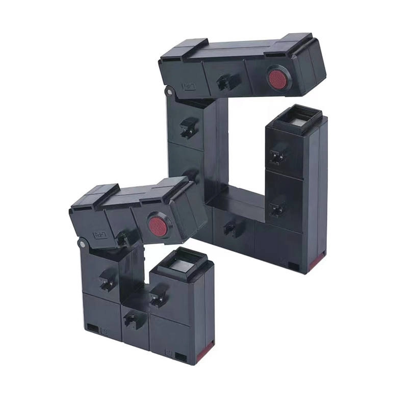 Opening Current Transformer small black 220 110 - EcoNewlink Black current transformers with red buttons, arranged in a geometric shape. - EcoNewlink