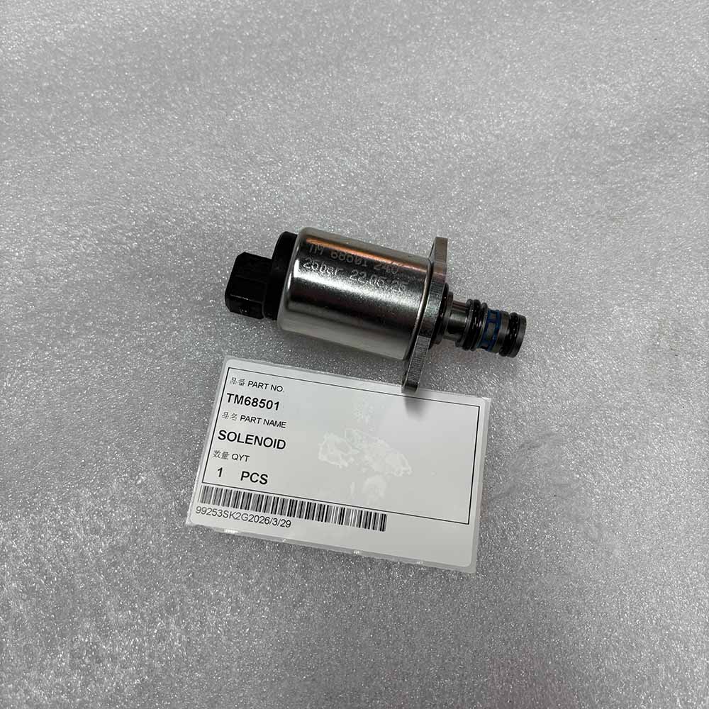 TM68501 Solenoid valve part with identification label on white foam surface.