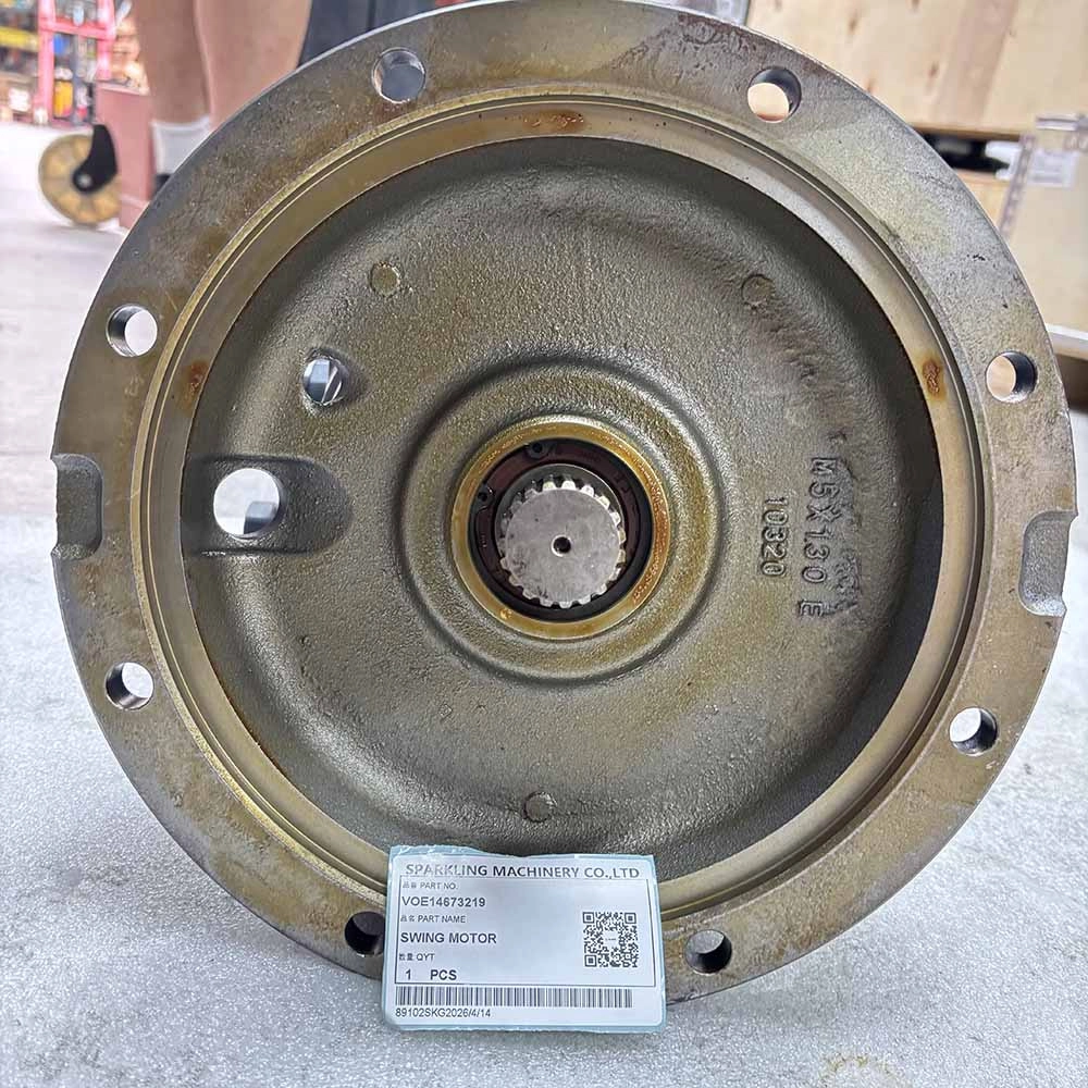Circular metal swing motor part with center gear and mounting holes.