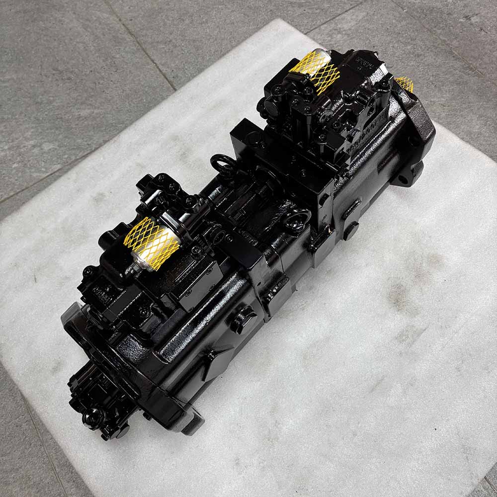 Black hydraulic piston pump for heavy machinery on a white surface.