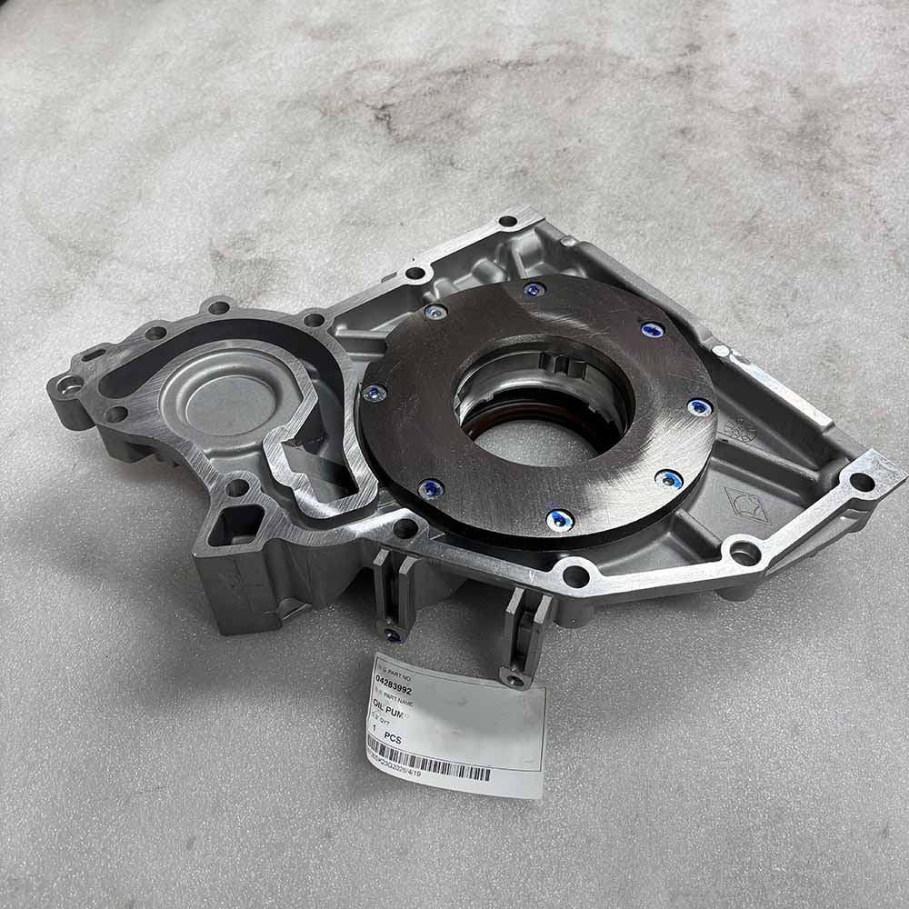 Aluminum engine 04283992 oil pump housing with internal rotor and part tag.