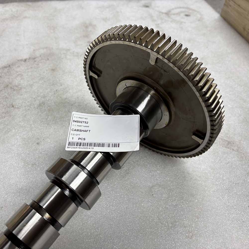 Metal engine 04502752 camshaft with a large gear and a product identification tag.
