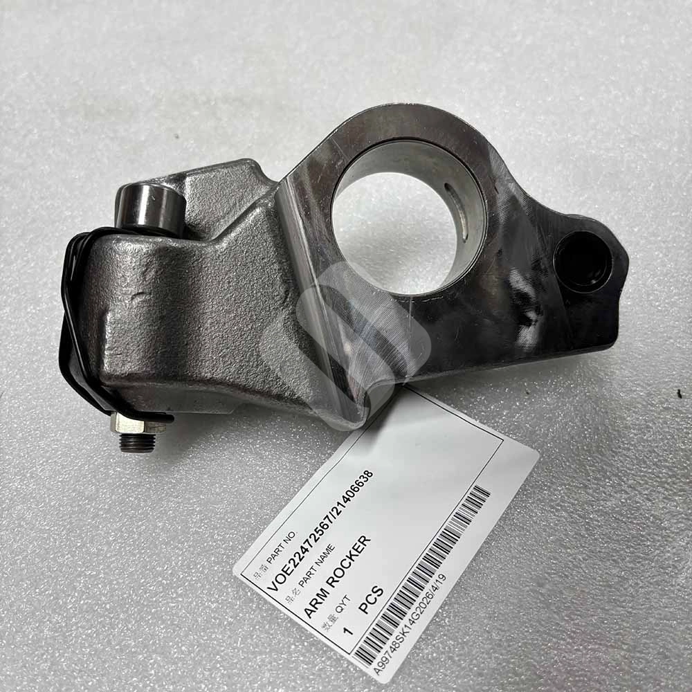 VOE22472567 21406638 Arm Rocker for Volvo Engine D13F, D13H, D13J VOE22472567/21406638 Metal engine rocker arm part with identification tag on a white surface.