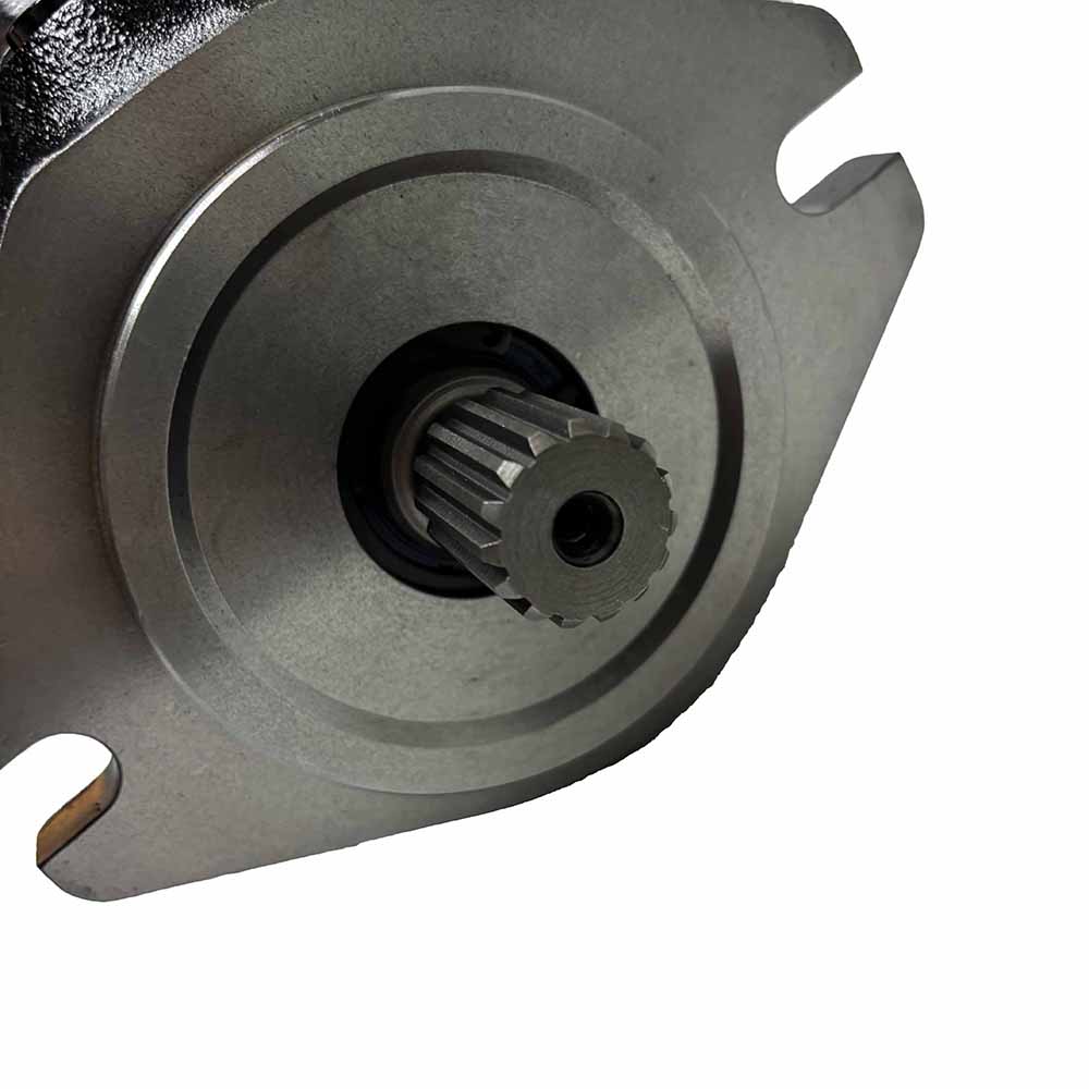 Close-up of a metal hydraulic pump mounting flange and splined drive shaft