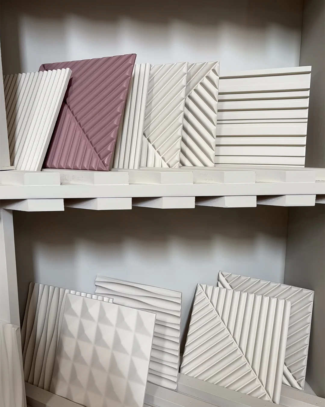 3d-geometric-wall-panels-in-white-and-pink-with-diagonal-groove-patterns-for-hotel-interiors