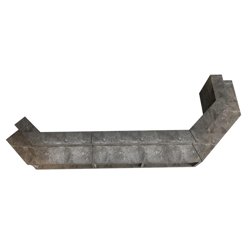 Overhead view of a gray marble corner bar top made of rectangular blocks.
