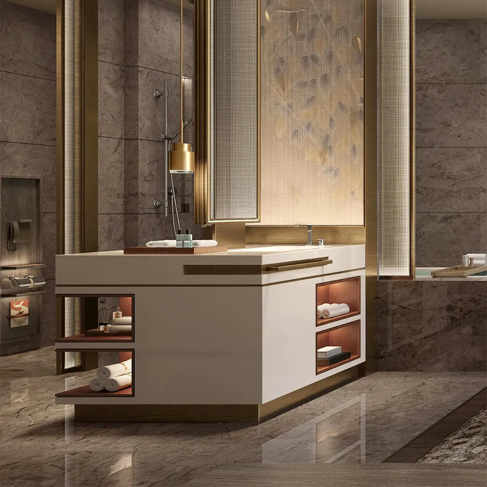 Bespoke bathroom vanity with Corian countertop, backlit mirror, open shelving, and brass accents in luxury hotel suite.