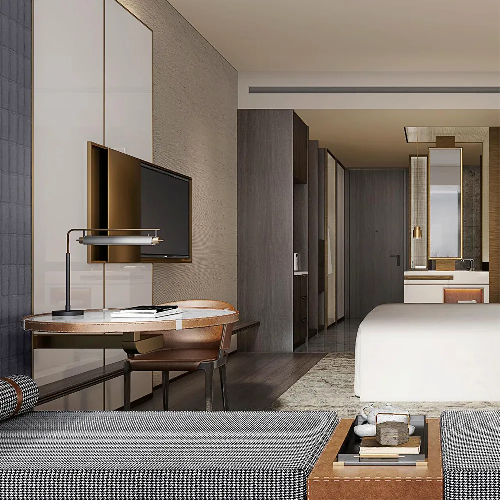 Elegant hotel room workspace with marble desk, leather chair, wall-mounted TV, and view into bathroom vanity area.