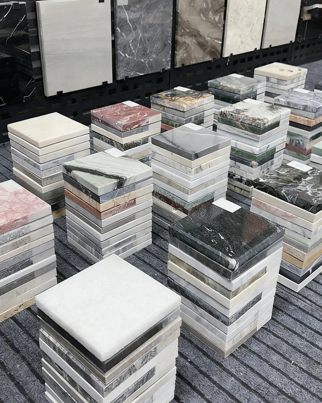stacked-square-marble-and-quartz-samples-in-multiple-colors-for-hotel-design-selection
