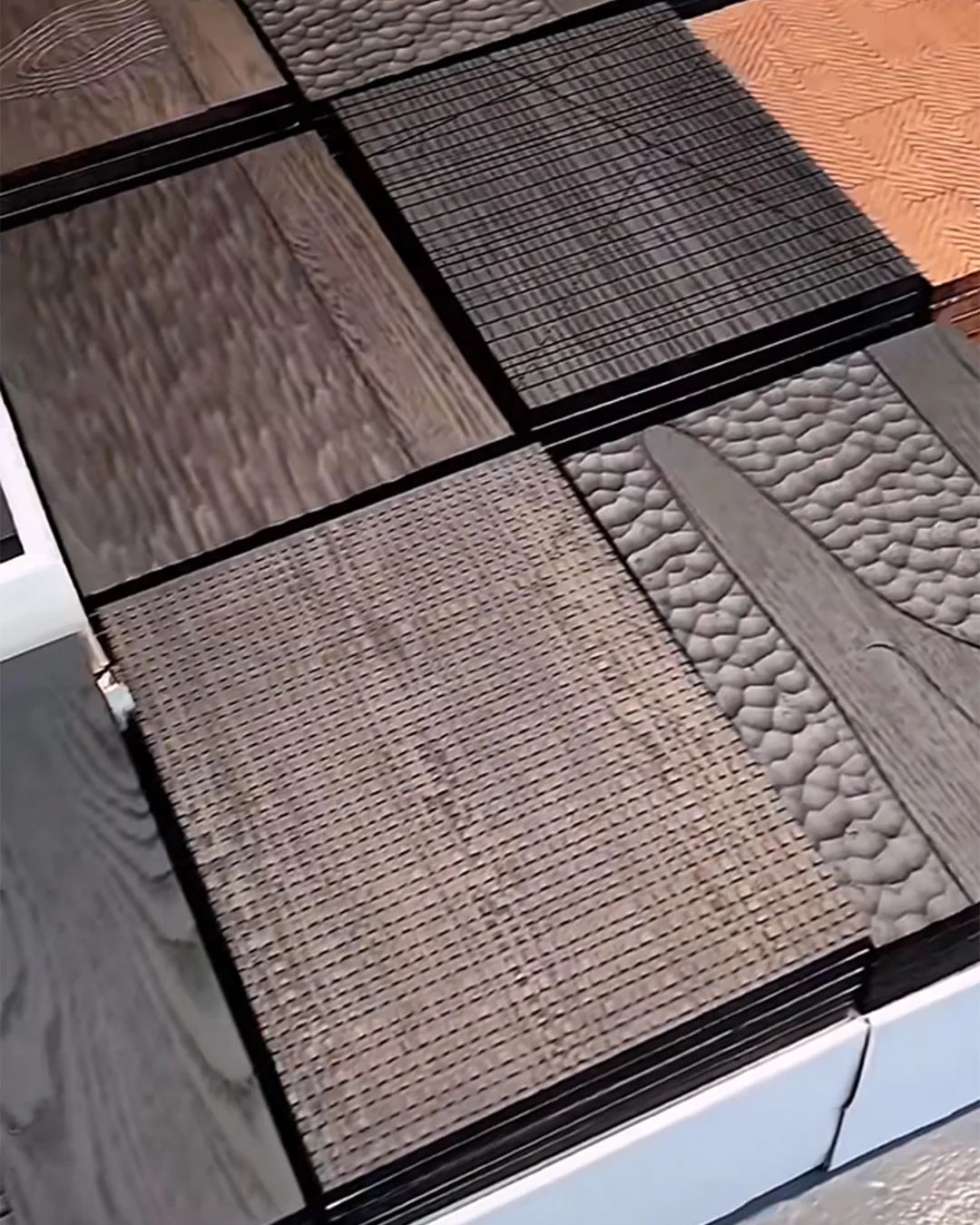 stacked-textured-laminate-samples-with-woven-hammered-and-wood-grain-finishes-for-hotels