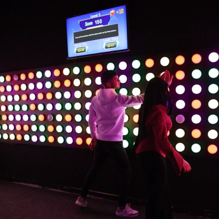 Push button wall game for active challenge rooms with reaction and memory modes