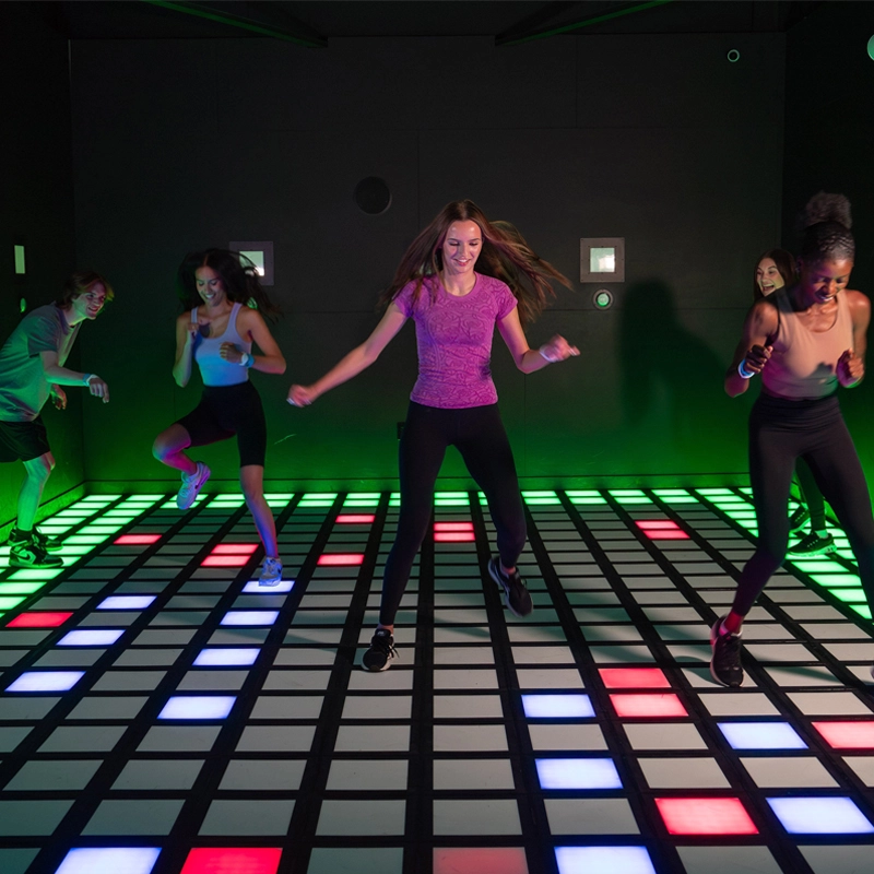 LED dance floor tiles with built-in game activation systems