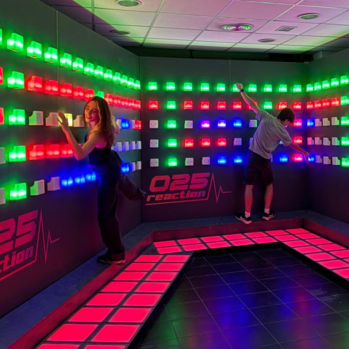 Professional LED floor system for family entertainment centers and active game room experiences, showing players stepping on illuminated tiles