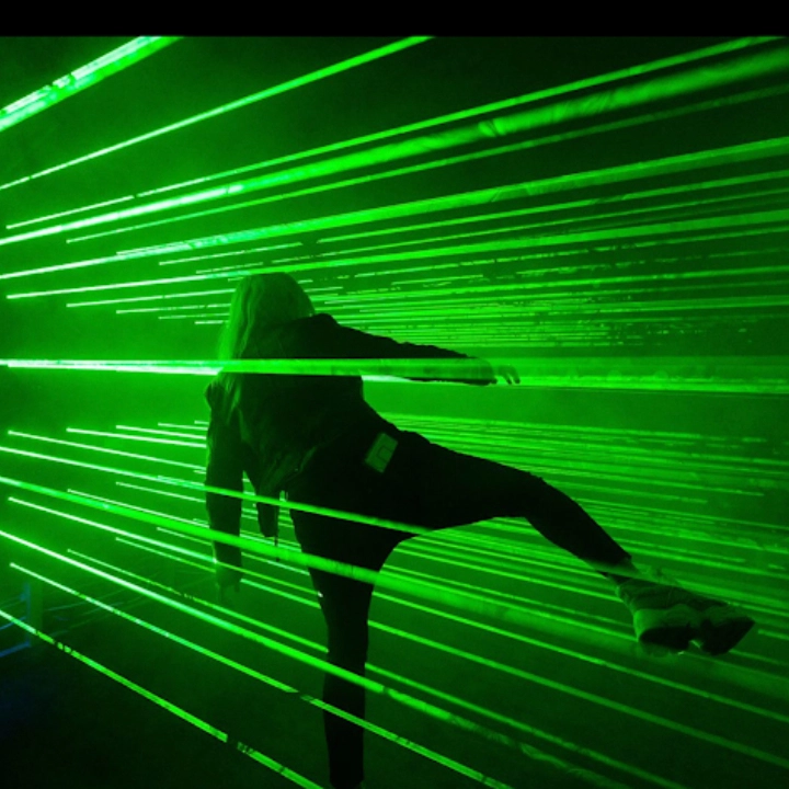 Interactive green laser maze game room for escape rooms and active challenge venues