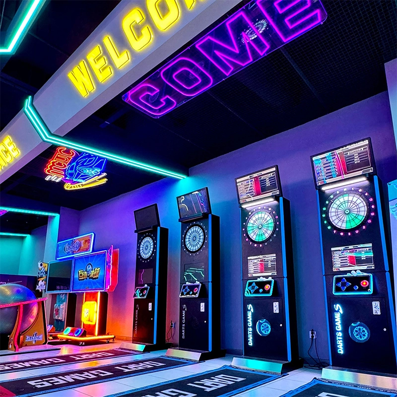 Commercial-Premises---Tide-Play-Sports-Hall Neon-lit arcade with multiple electronic dartboards and other games.