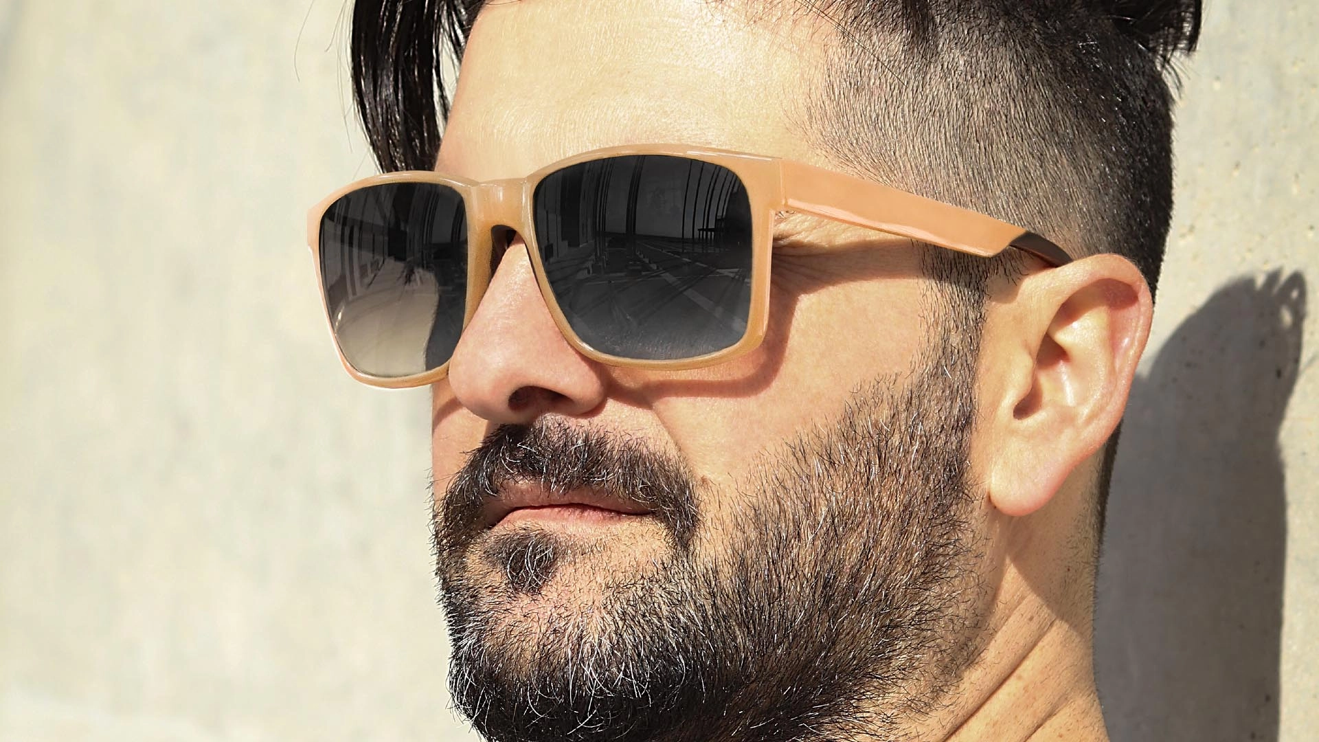 Sunglasses protect a man's eyes from the sun