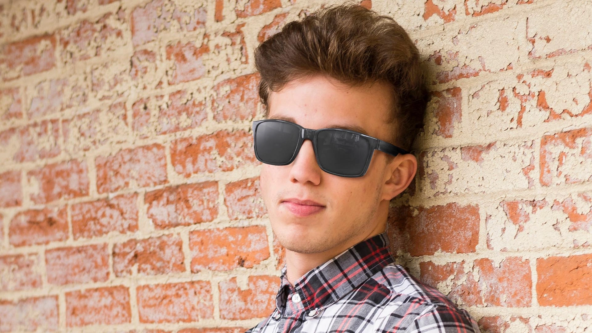 Sunglasses protect a man's eyes from the sun