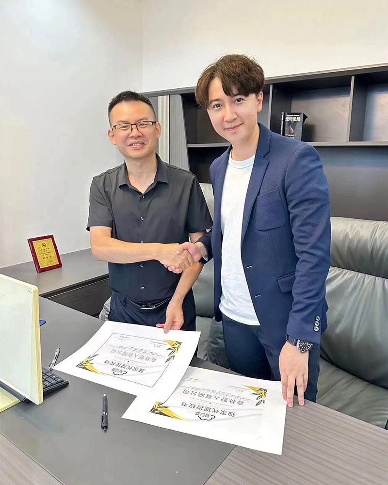 Signing-Exclusive-Vending-Machine-Distribution-Agreement---CEO-and-Client Signing Exclusive Vending Machine Distribution Agreement - CEO and Client