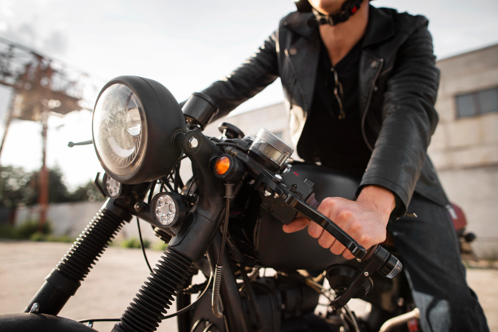 Rider on motorcycle with bright LED motorcycle driving lights for increased visibility.
