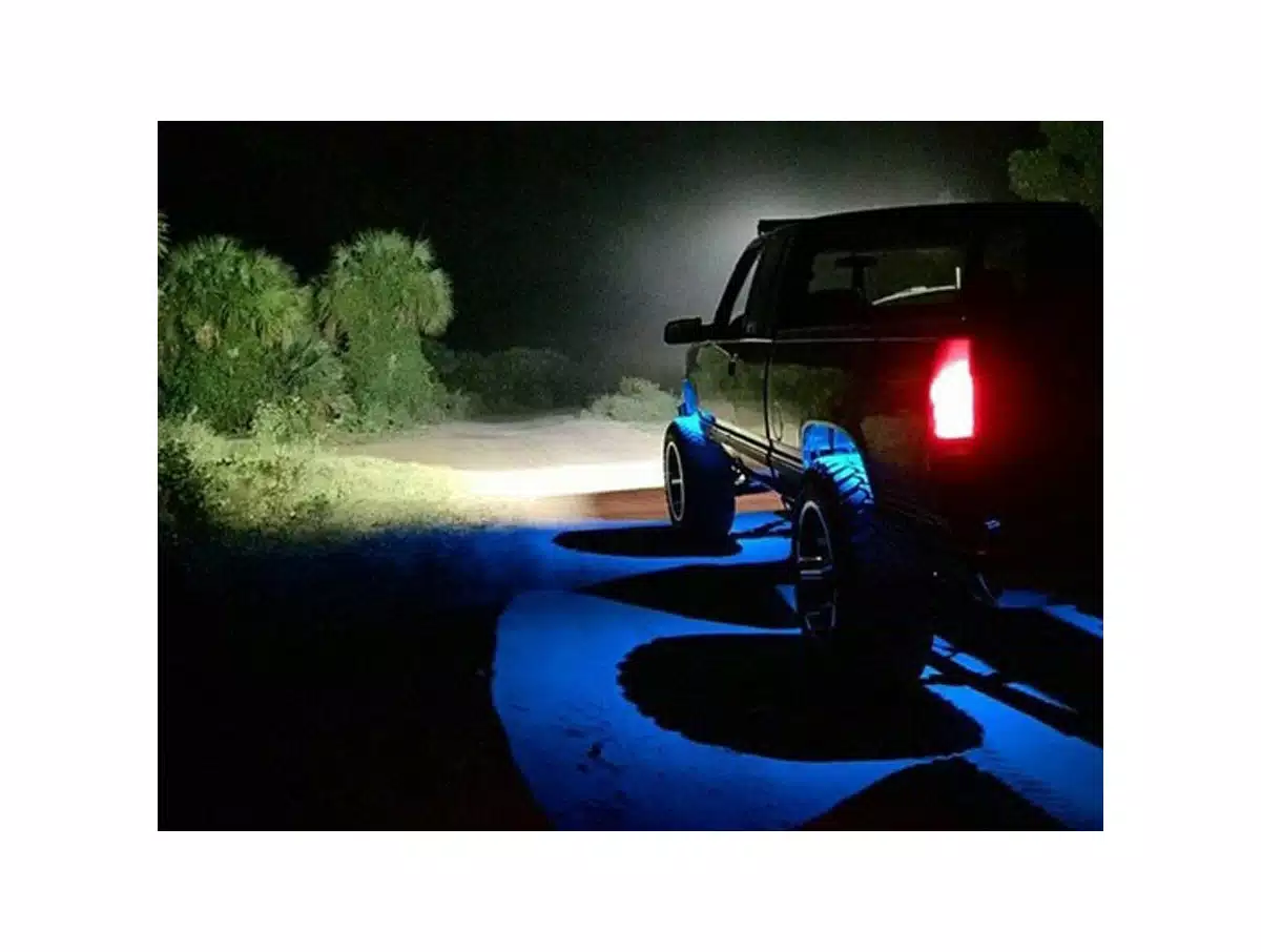 Truck-illuminated-with-blue-LED-rock-lights-at-night. Truck illuminated with blue LED rock lights at night.