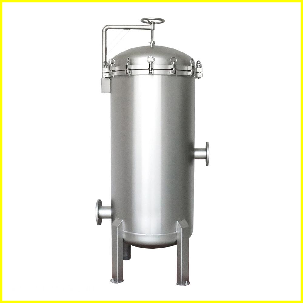 Stainless steel filter housing with a round top and a bottom base.  It is on four legs.