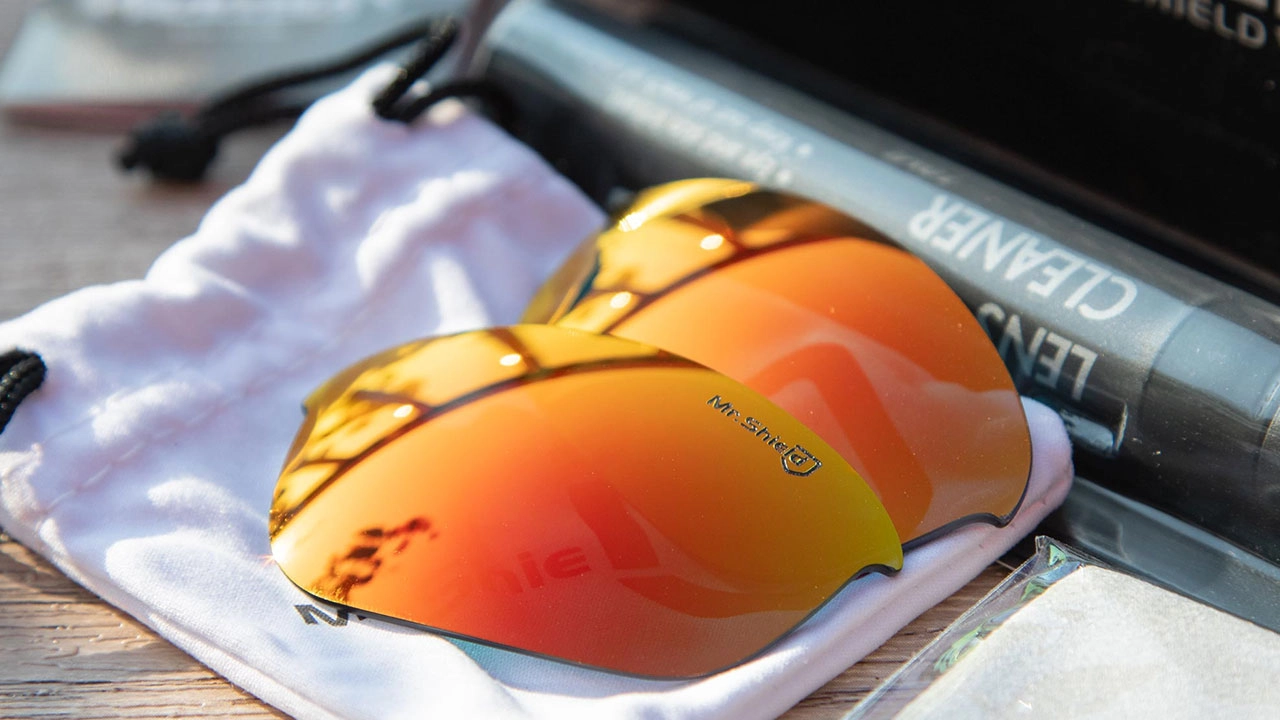 Mr. Shield orange mirrored sunglass replacement lenses with lens cleaner and pouch. - KARUSON