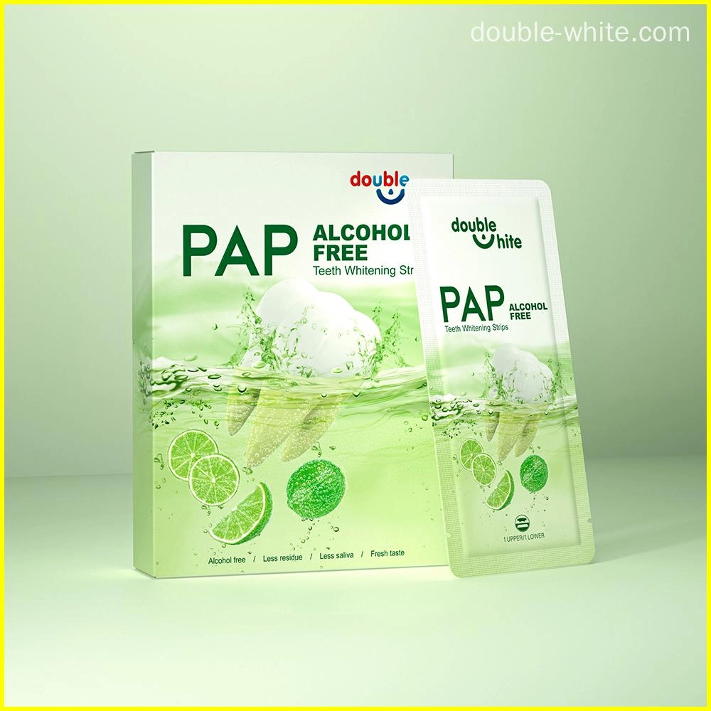 A box of Double White PAP+ Alcohol Free Teeth Whitening Strips. The box is green and white, and the strips are in a sealed packet.