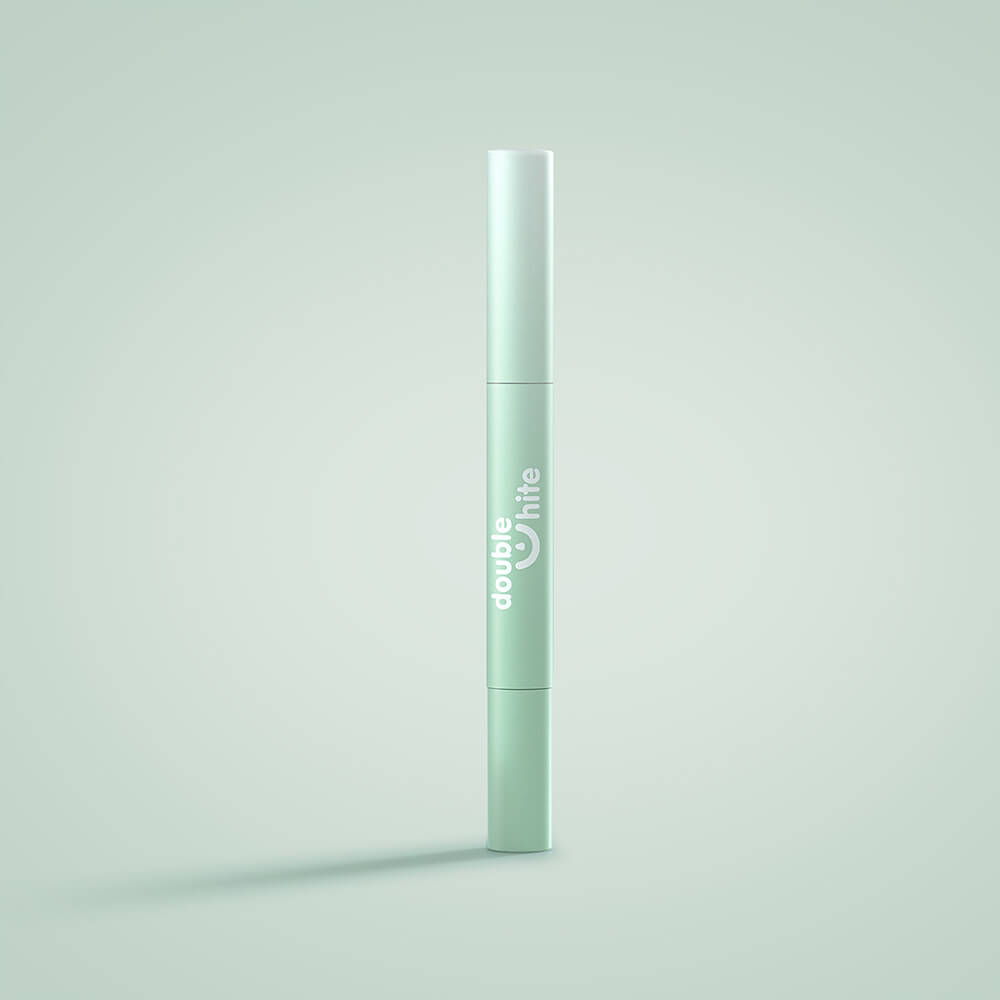 A green and white tube of Double White teeth whitening gel.