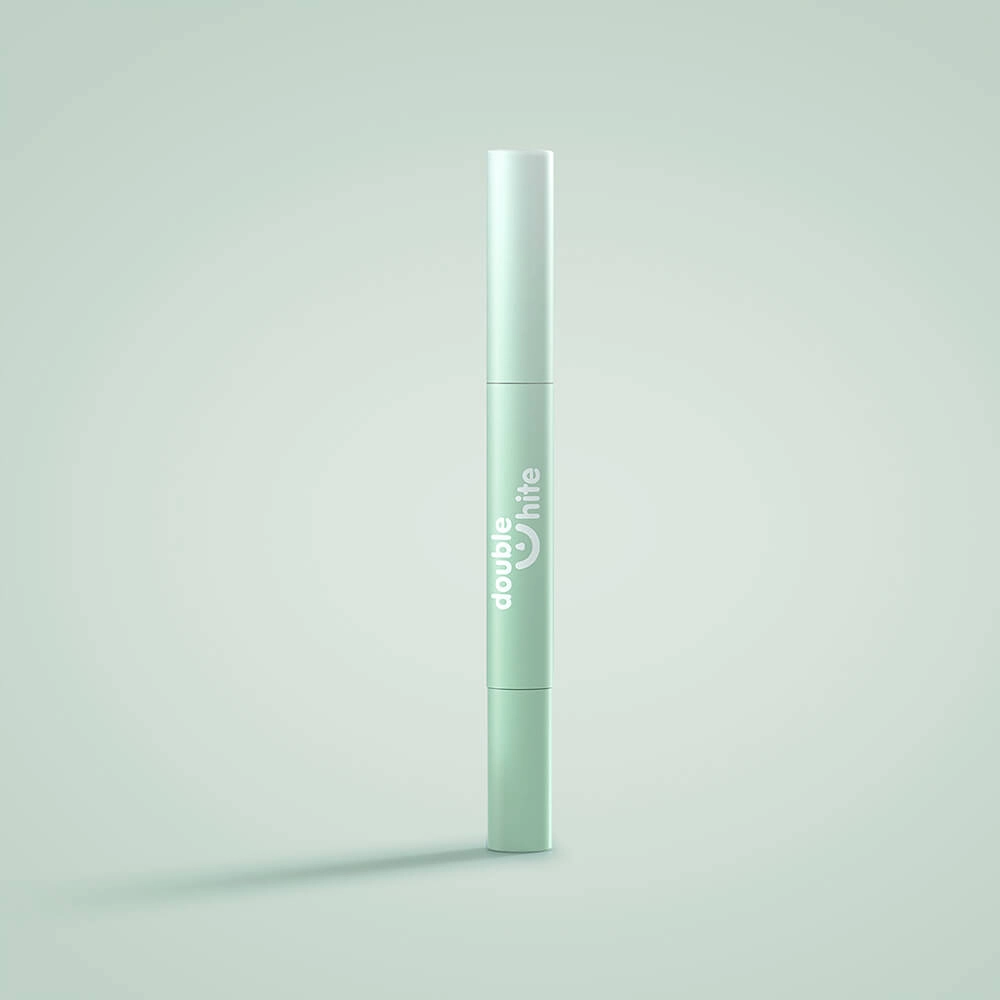 A green and white tube of Double White teeth whitening gel.