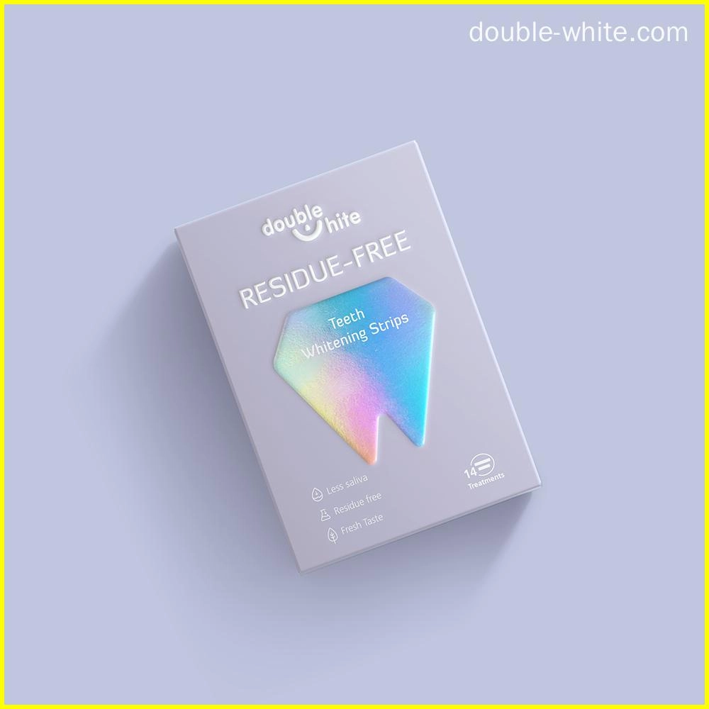 Коробка полосок для отбеливания зубов Double White Residue Free. Коробка белая с сине-фиолетовым градиентным ромбом на лицевой стороне.