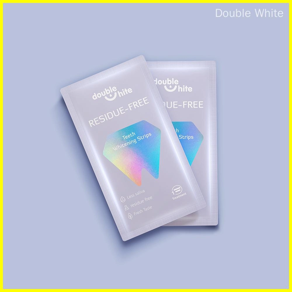 Two packages of Double White Residue-Free Teeth Whitening Strips.