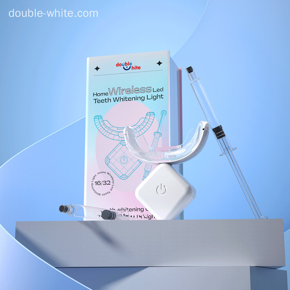 A box of Double White Home Wireless LED Teeth Whitening Light with a tube of whitening gel and a syringe with a needle.