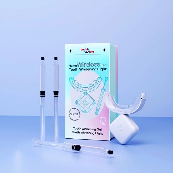 Double White wireless LED teeth whitening kit with three gel syringes and a wireless LED light.