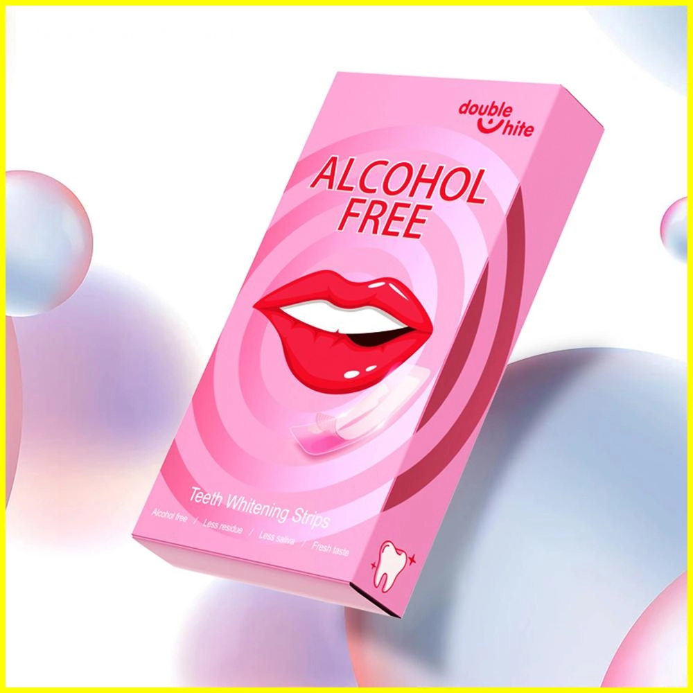¿Las tiras blanqueadoras dañan los dientes? Una caja de tiras blanqueadoras de dientes Double White. La caja es rosa y blanca y tiene una imagen de una boca sonriente con dientes blancos brillantes en el frente.