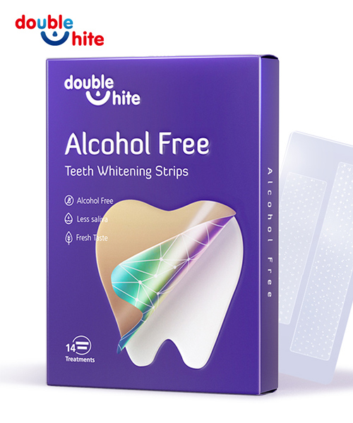 Tiras de Clareamento Dental Sem Álcool Double White. A caixa tem um fundo roxo com uma janela transparente mostrando as tiras dentro. O texto na caixa é branco e roxo.