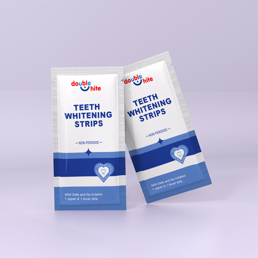 Two white and blue packages of Double White Teeth Whitening Strips.