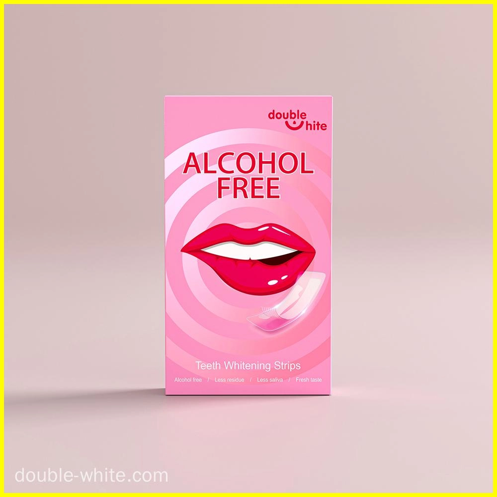 Una caja de tiras blanqueadoras de dientes Double White. La caja es rosa y blanca, con una imagen de una boca sonriente en el frente. Las tiras no contienen alcohol y dejan menos residuos, menos saliva y un sabor fresco.