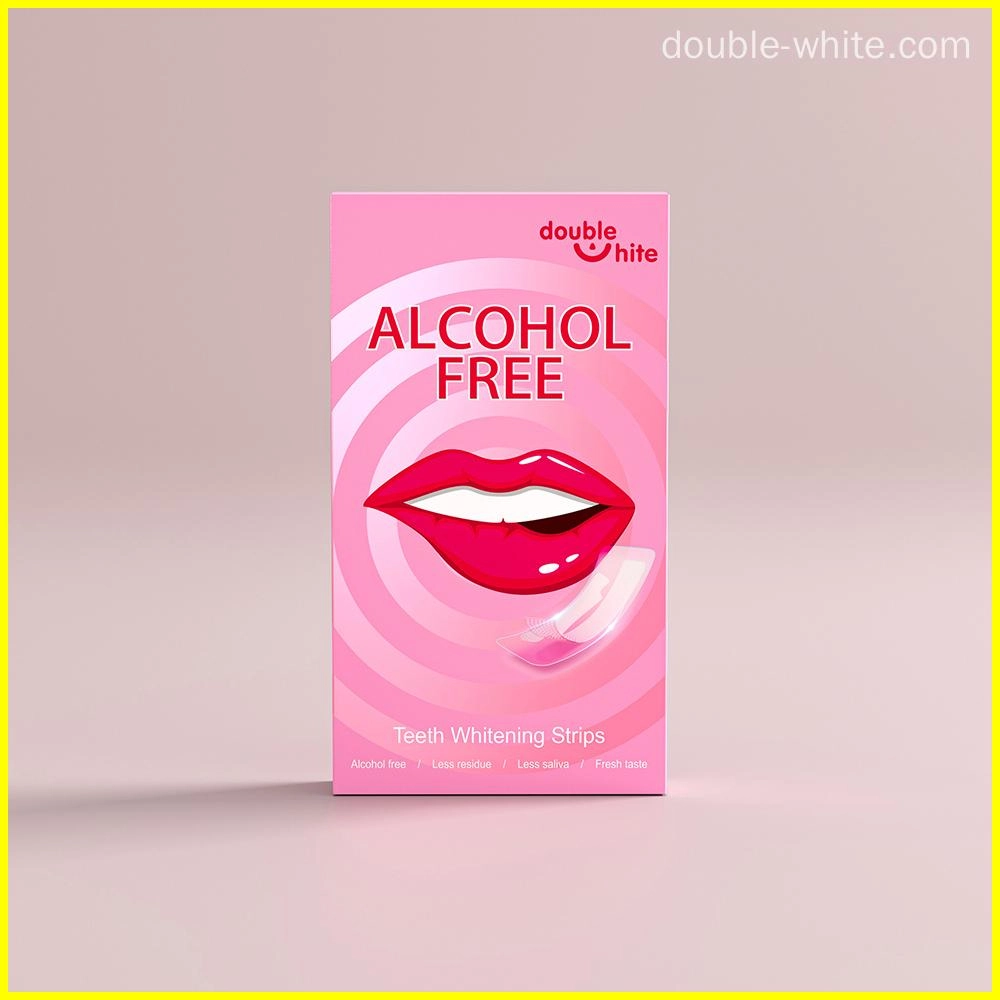 Una caja de tiras blanqueadoras de dientes Double White. La caja es rosa y blanca, con una imagen de una boca sonriente en el frente. Las tiras no contienen alcohol y dejan menos residuos, menos saliva y un sabor fresco.