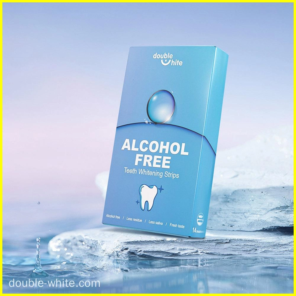 meilleures-bandes-blanchissantes-pour-les-dents Une boîte de bandes blanchissantes pour les dents Double White. La boîte est bleue et blanche et porte les inscriptions « Double White », « Sans alcool » et « Bandes blanchissantes pour les dents ».
