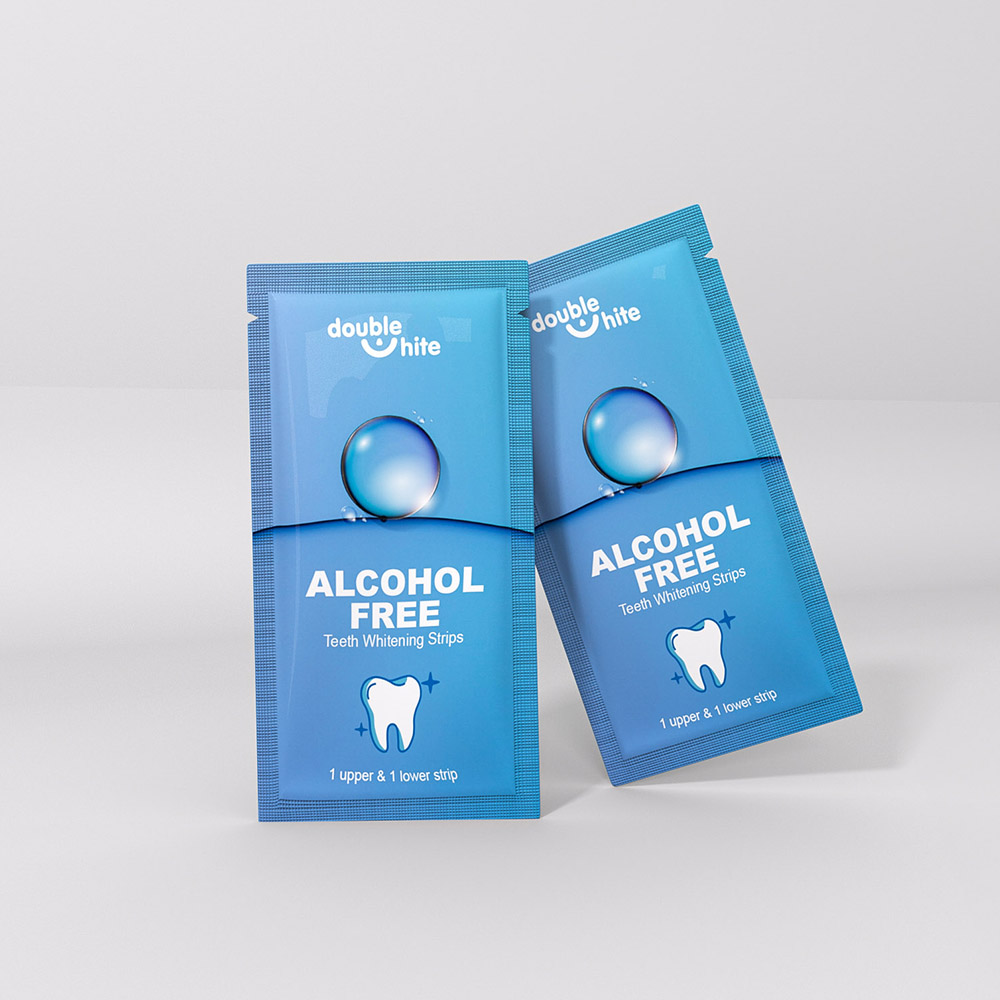 Two blue and white Double White Alcohol Free Teeth Whitening Strips packages.