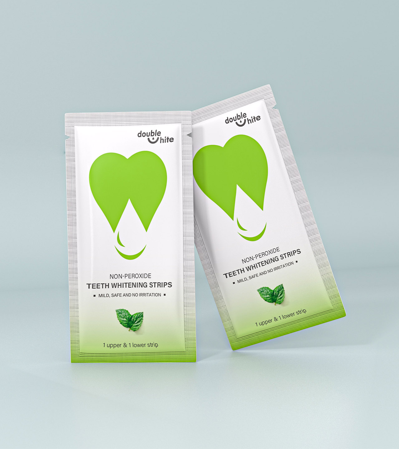 Two green and white packages of Double White non-peroxide teeth whitening strips.