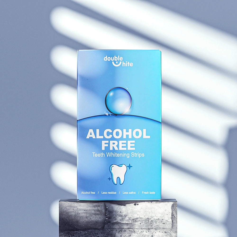 A box of Double White teeth whitening strips. The box is blue and white, with the Double White logo and 