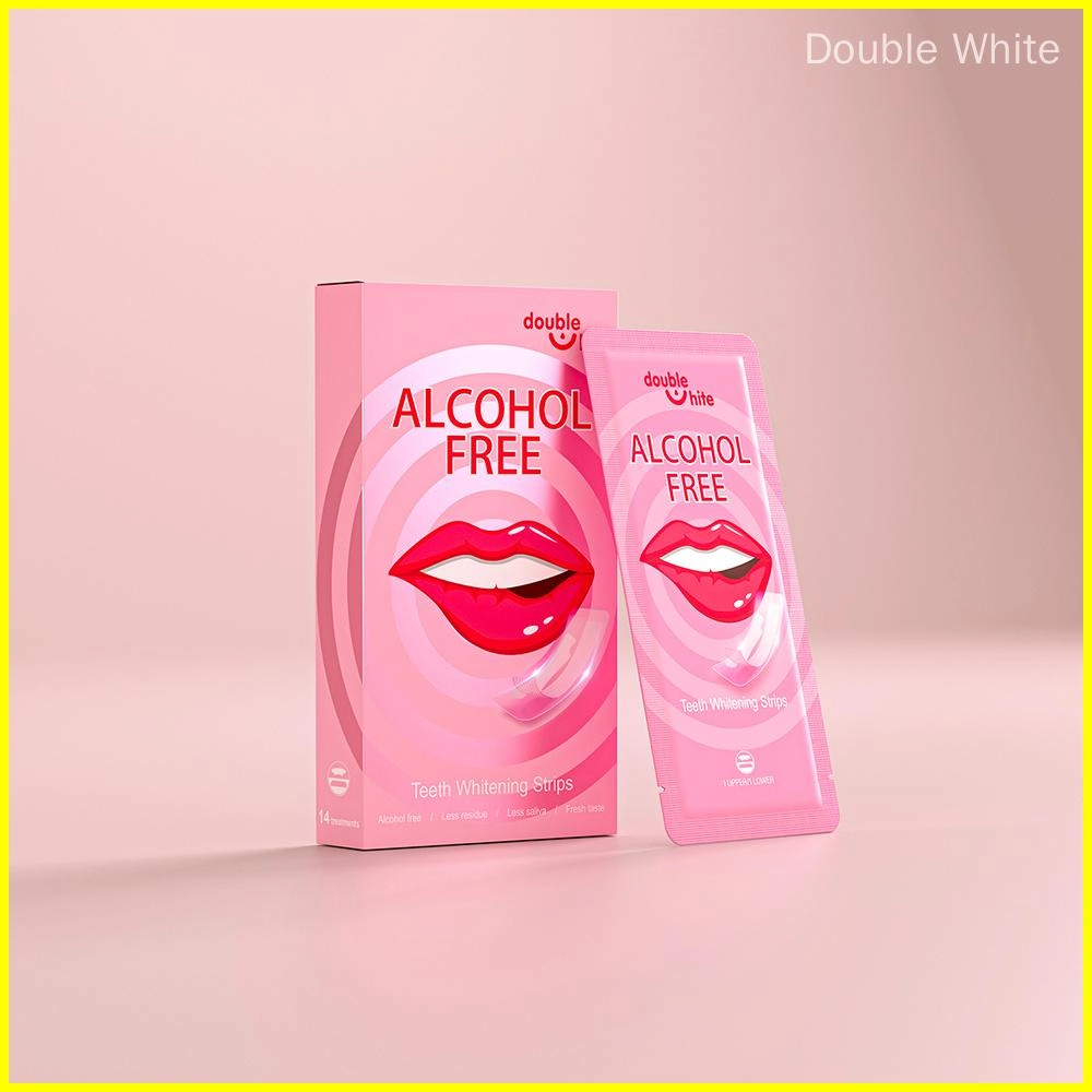 les-bandes-blanchissantes-sont-elles-mauvaises-pour-vos-dents Une boîte de bandes de blanchiment des dents Double White avec une image d'une bouche souriante sur le devant. La boîte est rose et blanche, et les bandes sont scellées dans un emballage en plastique transparent.