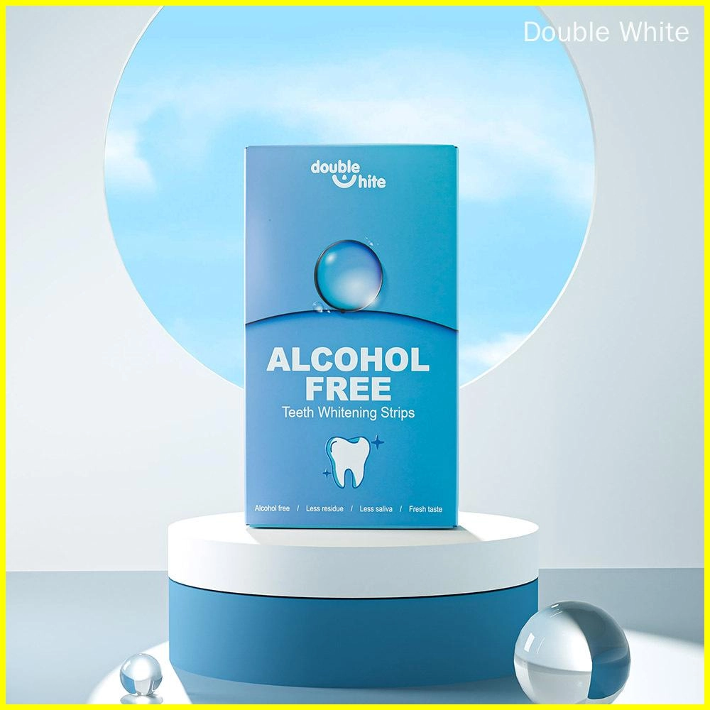 A box of Double White teeth whitening strips. The box is blue and white. The front of the box has the Double White logo, the product name, and a list of the product's benefits.