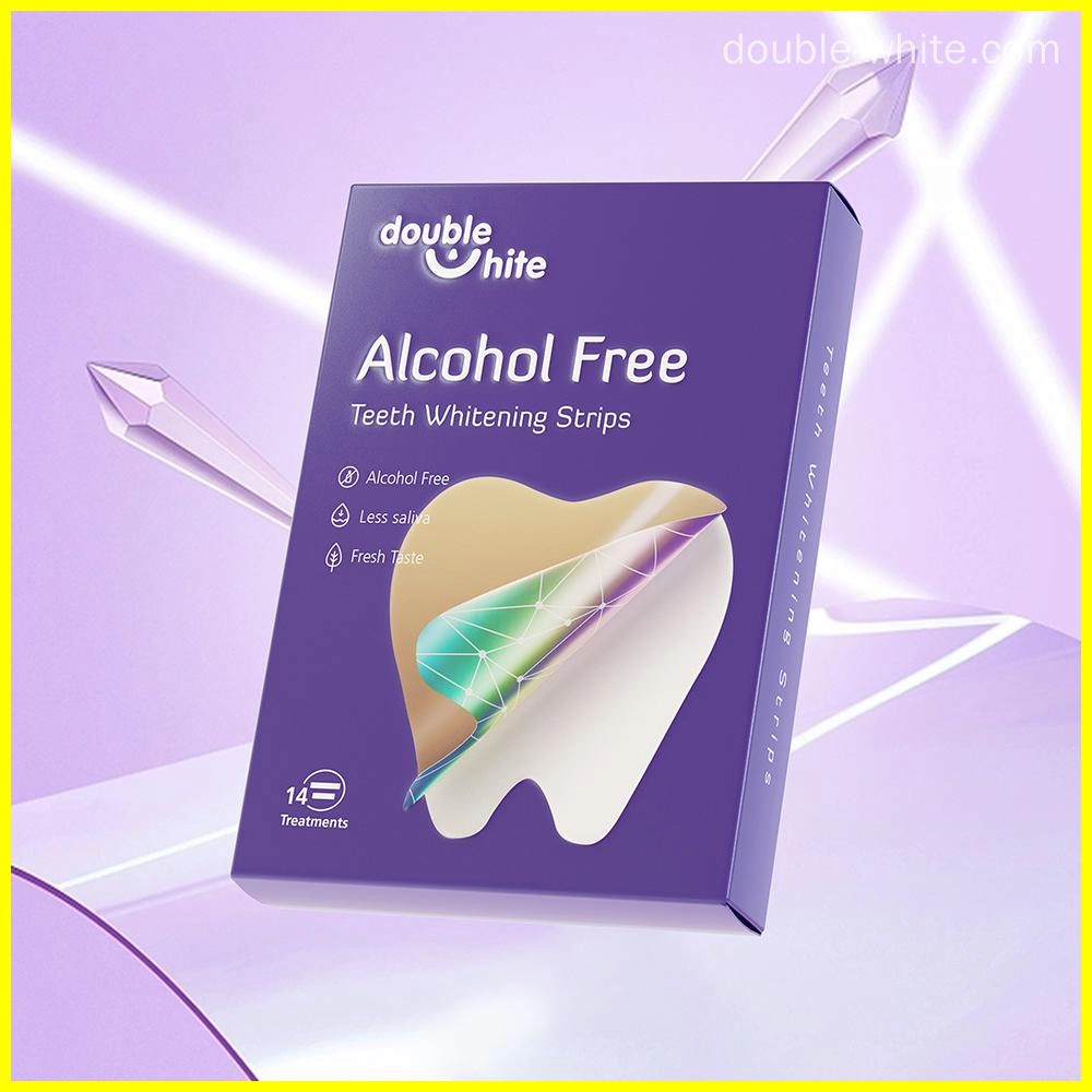 A purple and white box of Double White Alcohol-Free Teeth Whitening Strips. The box has a clear window on the front so you can see the strips inside. There are 14 treatments in each box.