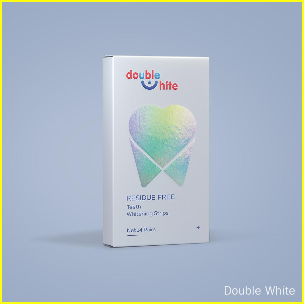 A box of Double White teeth whitening strips. The box is white with a blue and pink gradient tooth on the front. The text on the box is "double white", "residue-free", "teeth whitening strips", and "net 14 pairs".