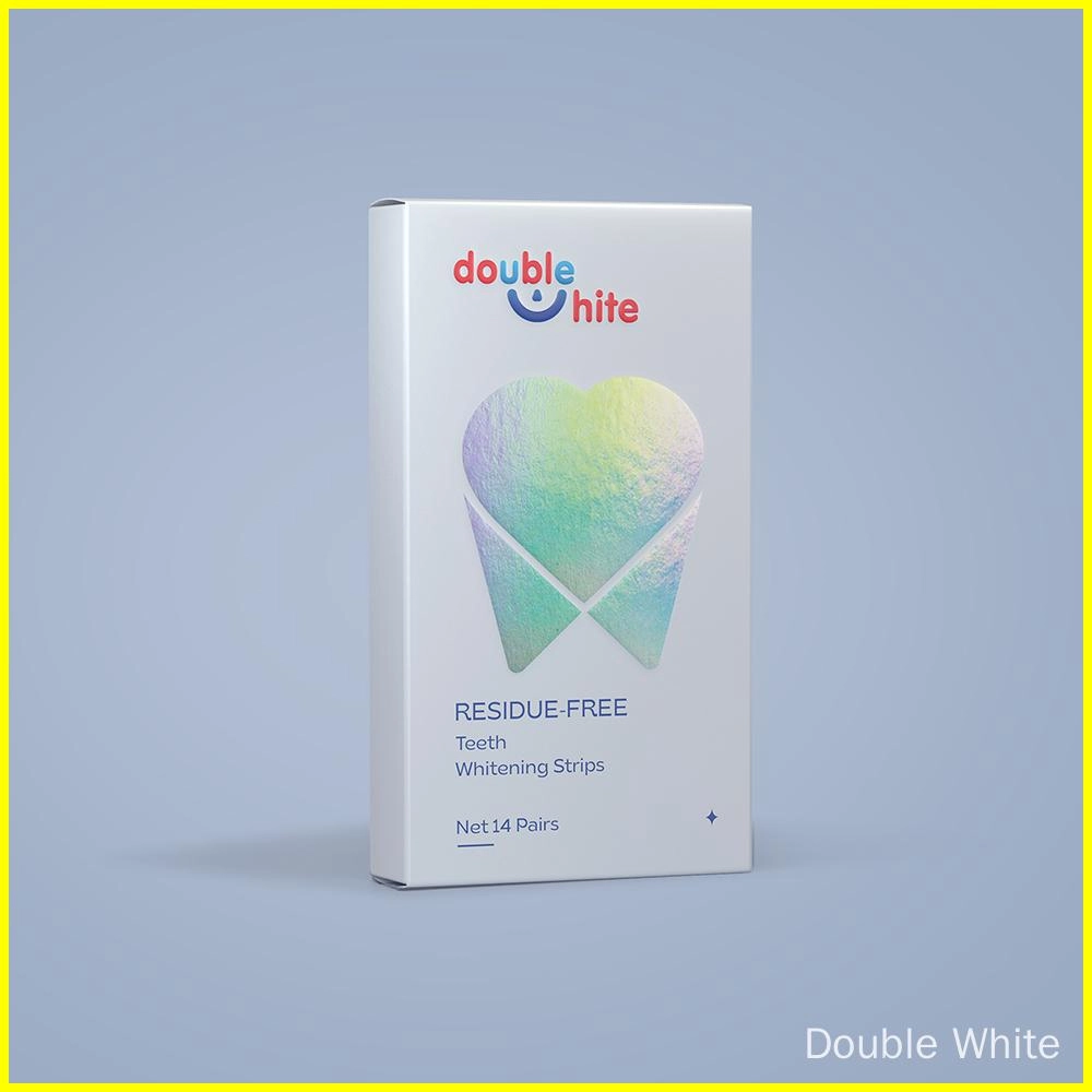 A box of Double White teeth whitening strips. The box is white with a blue and pink gradient tooth on the front. The text on the box is "double white", "residue-free", "teeth whitening strips", and "net 14 pairs".