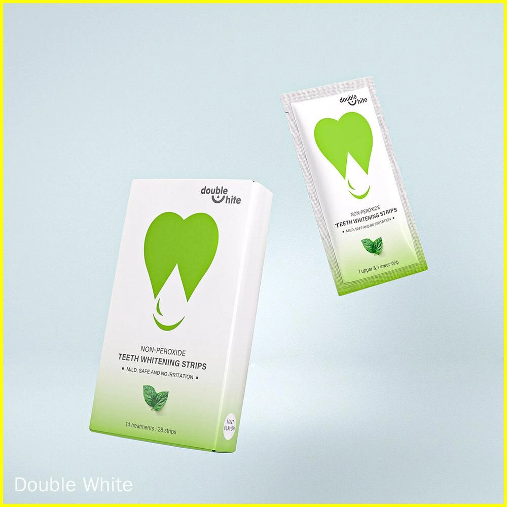 Коробка полосок для отбеливания зубов Double White без перекиси. Коробка бело-зеленая, полоски находятся в запечатанном пакете.